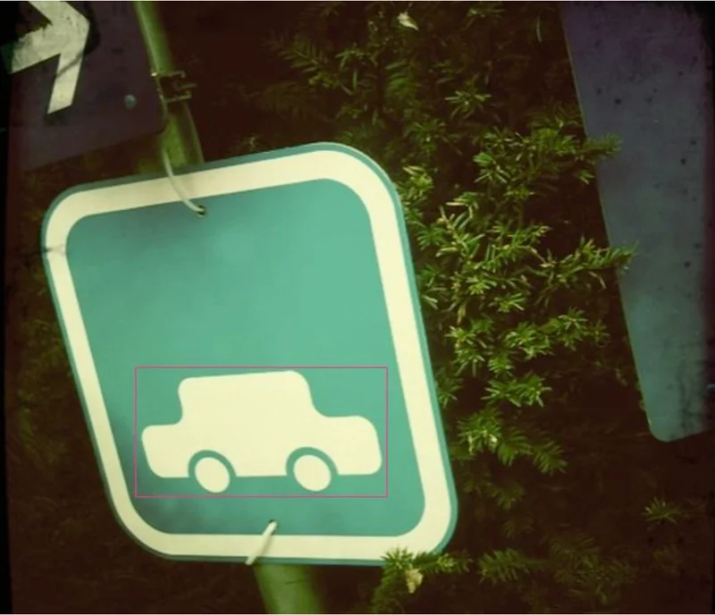 Road sign with car icon incorrectly annotated as a car